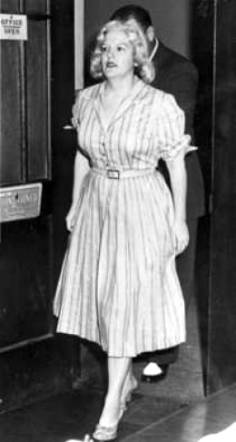 Woman in white dress taken in 1950s